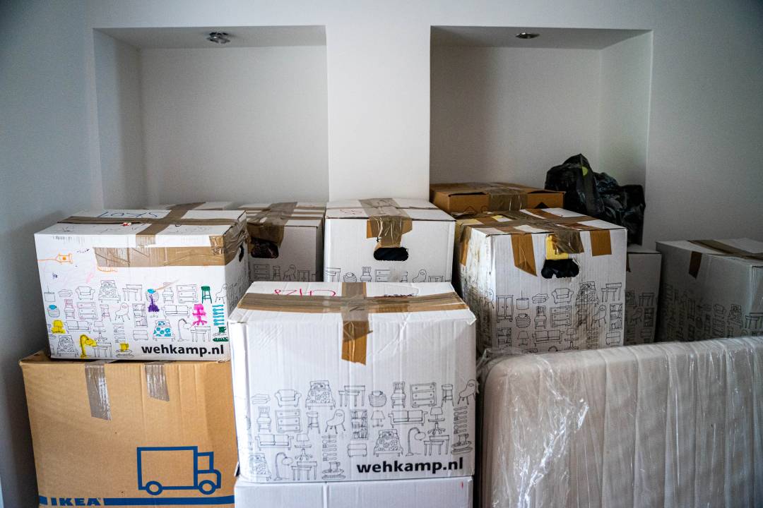 Boxes Piled High In A Room